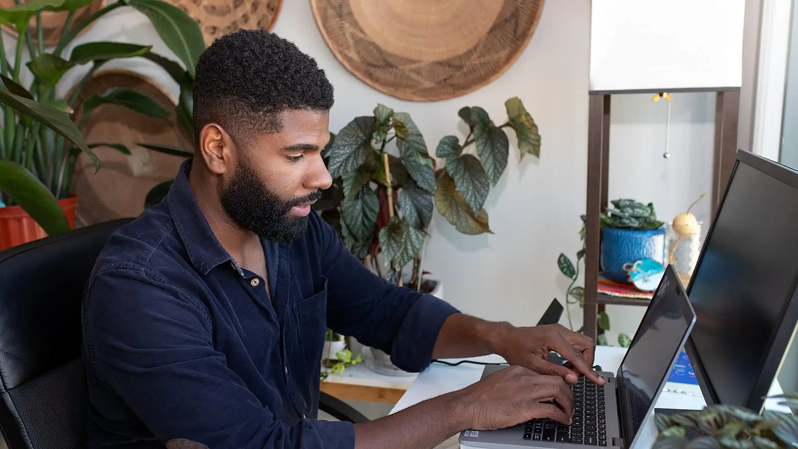 A man working from a desk at home